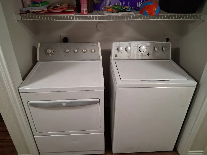 Real washer and dryer installation in a laundry closet